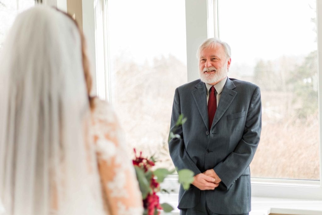 father seeing bride for the first time on wedding day